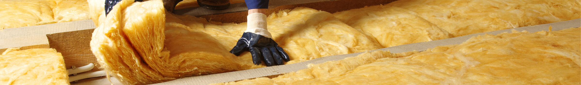 Insulation material in a roof or attic space